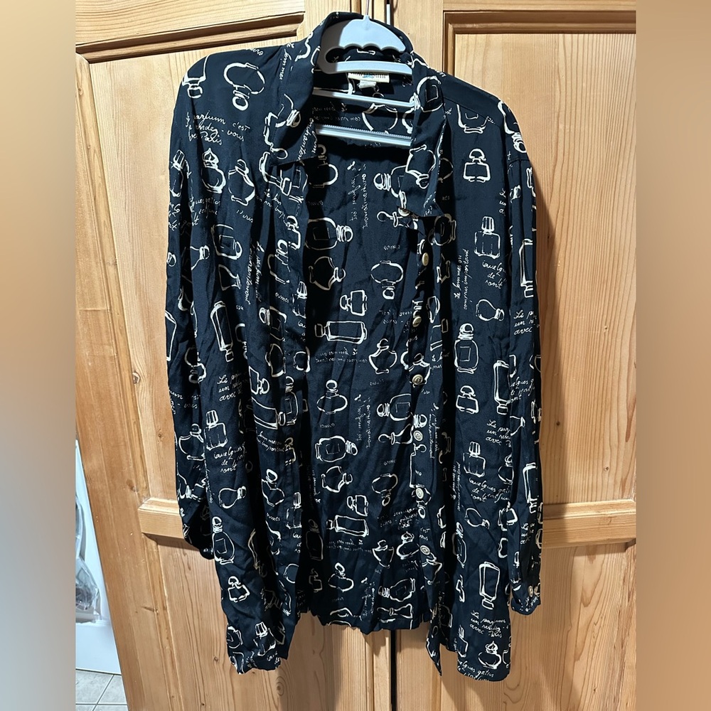Long oversized, black button up apothecary style.